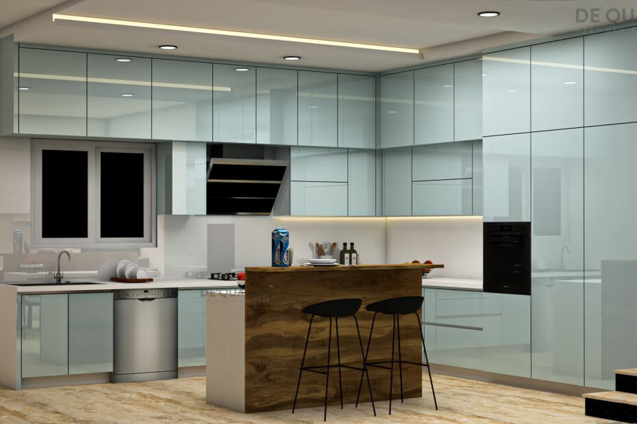 Modern island kitchen with sleek quartz countertop, built-in storage, and pendant lighting, showcasing a contemporary home interior in Bangalore.